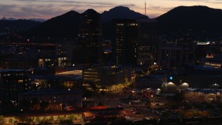 DX0002_147_035 - 5.7K aerial stock footage of an orbit of three tall office towers at twilight, Downtown Tucson, Arizona