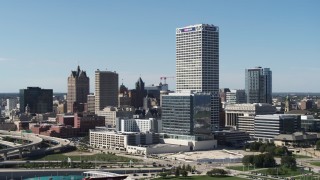 DX0002_149_007 - 5.7K aerial stock footage of passing tall city buildings and a skyscraper in Downtown Milwaukee, Wisconsin