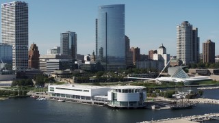 DX0002_149_013 - 5.7K aerial stock footage of circling the Discovery World museum in Downtown Milwaukee, Wisconsin