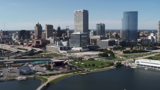 DX0002_149_032 - 5.7K aerial stock footage of a view of tall skyscrapers seen from Milwaukee Bay, Downtown Milwaukee, Wisconsin