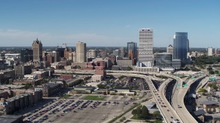 DX0002_149_042 - 5.7K aerial stock footage of a reverse view of the city's skyline and I-794 in Downtown Milwaukee, Wisconsin
