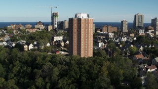 DX0002_150_008 - 5.7K aerial stock footage of orbiting around an apartment complex in Milwaukee, Wisconsin