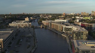 DX0002_150_023 - 5.7K aerial stock footage apartment complexes by the Milwaukee River at sunset, Milwaukee, Wisconsin