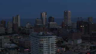 DX0002_150_037 - 5.7K aerial stock footage a view of Downtown Milwaukee, Wisconsin at twilight