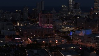 DX0002_151_009 - 5.7K aerial stock footage orbit a downtown office building at night, Downtown Milwaukee, Wisconsin