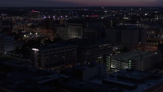 DX0002_151_010 - 5.7K aerial stock footage of the Milwaukee County Circuit Court at night, Milwaukee, Wisconsin