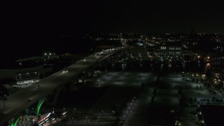 DX0002_151_029 - 5.7K aerial stock footage of light traffic on Interstate 794 at night, Downtown Milwaukee, Wisconsin