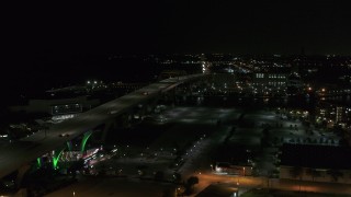 DX0002_151_030 - 5.7K aerial stock footage of a view of light traffic on Interstate 794 at night, Downtown Milwaukee, Wisconsin