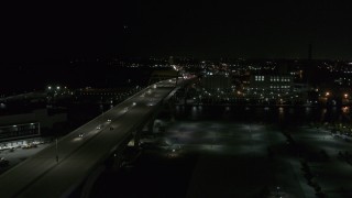 DX0002_151_033 - 5.7K aerial stock footage of light traffic on I-794 freeway at night, Downtown Milwaukee, Wisconsin