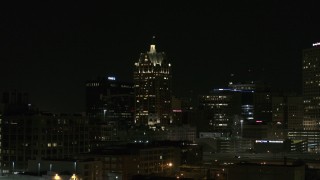 DX0002_151_038 - 5.7K aerial stock footage of a skyscraper in Downtown Milwaukee, Wisconsin at night