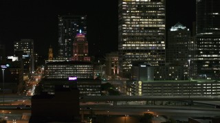 DX0002_151_042 - 5.7K aerial stock footage of a view of the Wisconsin Gas Building in Downtown Milwaukee, Wisconsin at night