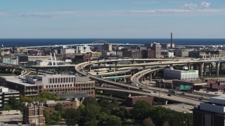 DX0002_152_010 - 5.7K aerial stock footage reverse view of light traffic on I-794 interchange in Downtown Milwaukee, Wisconsin