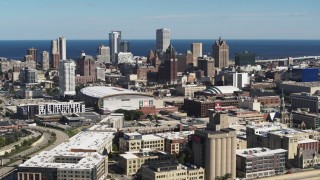 DX0002_152_022 - 5.7K aerial stock footage of the city's skyline and arena in Downtown Milwaukee, Wisconsin, seen from I-43
