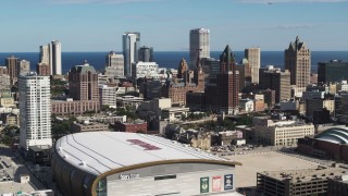 DX0002_152_036 - 5.7K aerial stock footage fly toward the city's skyline from the arena in Downtown Milwaukee, Wisconsin
