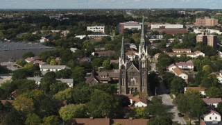DX0002_152_039 - 5.7K aerial stock footage of orbiting a church in Milwaukee, Wisconsin