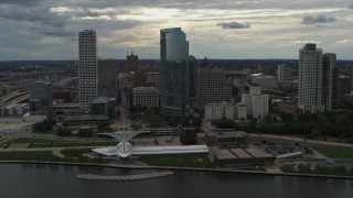 DX0002_154_009 - 5.7K aerial stock footage flyby and away from skyscrapers and the art museum by Lake Michigan in Downtown Milwaukee, Wisconsin