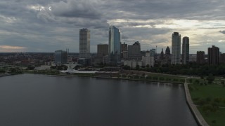 DX0002_154_011 - 5.7K aerial stock footage reverse view of city skyline and the art museum by Lake Michigan in Downtown Milwaukee, Wisconsin