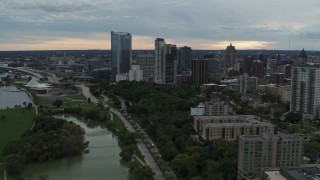 DX0002_154_039 - 5.7K aerial stock footage reverse view of the city's skyline from Veterans Park, Downtown Milwaukee, Wisconsin