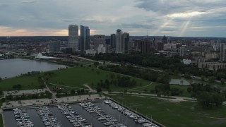 DX0002_154_041 - 5.7K aerial stock footage reverse view of Veterans Park and skyline of Downtown Milwaukee, Wisconsin