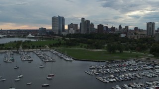 DX0002_154_044 - 5.7K aerial stock footage fly over marina toward Veterans Park and skyline of Downtown Milwaukee, Wisconsin