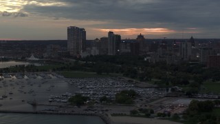 DX0002_155_026 - 5.7K aerial stock footage stationary view of the city's skyline, seen from the marina at twilight, Downtown Milwaukee, Wisconsin
