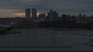 DX0002_155_030 - 5.7K aerial stock footage of flying past the marina with a view of the city's skyline at twilight, Downtown Milwaukee, Wisconsin
