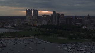 DX0002_155_032 - 5.7K aerial stock footage a stationary view of the city's skyline at twilight from over the marina, Downtown Milwaukee, Wisconsin