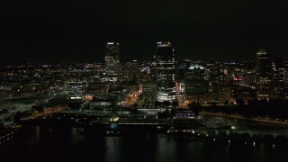 DX0002_157_007 - 5.7K aerial stock footage of towering skyscrapers near the shoreline at night, Downtown Milwaukee, Wisconsin