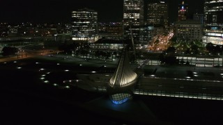 DX0002_157_019 - 5.7K aerial stock footage circling the lakefront museum at night before flying away, Downtown Milwaukee, Wisconsin