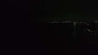 DX0002_157_021 - 5.7K aerial stock footage of a view of the shore of Lake Michigan at night, Milwaukee, Wisconsin
