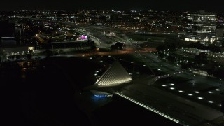 DX0002_157_027 - 5.7K aerial stock footage orbit lakefront museum rooftop at night, Downtown Milwaukee, Wisconsin