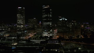 DX0002_157_033 - 5.7K aerial stock footage of a wide orbit of a tall skyscraper at night, Downtown Milwaukee, Wisconsin