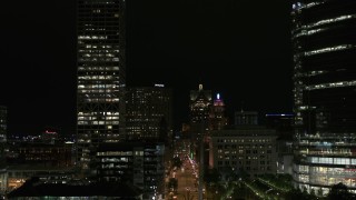 DX0002_157_053 - 5.7K aerial stock footage fly over museum near skyscrapers, reveal city street at night, Downtown Milwaukee, Wisconsin