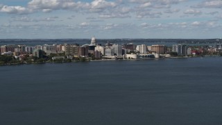 DX0002_158_004 - 5.7K aerial stock footage slowly approach lakefront city buildings in Madison, Wisconsin