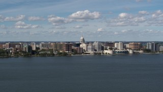 DX0002_158_006 - 5.7K aerial stock footage slowly flying by lakefront city buildings in Madison, Wisconsin