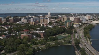 DX0002_158_018 - 5.7K aerial stock footage of passing apartment complexes around the capitol dome in Madison, Wisconsin