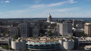 DX0002_158_025 - 5.7K aerial stock footage of the capitol dome and office buildings, reveal convention center, Madison, Wisconsin