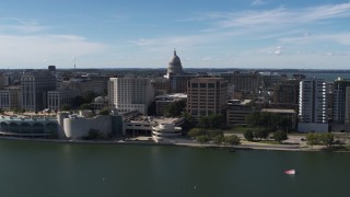 DX0002_158_030 - 5.7K aerial stock footage passing convention center with view of capitol dome, office buildings, Madison, Wisconsin