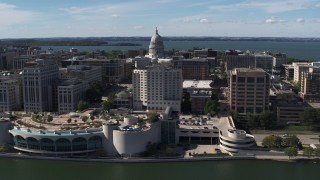 DX0002_158_037 - 5.7K aerial stock footage of the capitol dome and office buildings, seen while from the convention center, Madison, Wisconsin