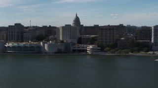 DX0002_160_006 - 5.7K aerial stock footage dome of the capitol seen while flying away from office buildings and convention center, Madison, Wisconsin