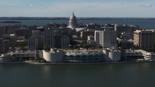 DX0002_160_012 - 5.7K aerial stock footage of slowly passing the convention center with capitol and office buildings in background, Madison, Wisconsin