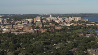 DX0002_161_002 - 5.7K aerial stock footage a stationary view of the capitol dome from a residential neighborhood, Madison, Wisconsin