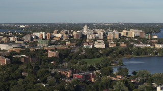 DX0002_161_005 - 5.7K aerial stock footage flying by the capitol dome and downtown seen from a residential neighborhood, Madison, Wisconsin