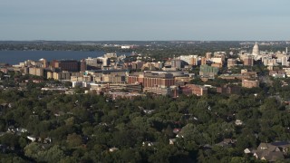 DX0002_161_010 - 5.7K aerial stock footage of orbiting a hospital near downtown, Madison, Wisconsin