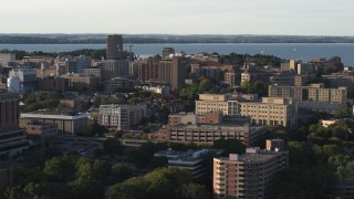 DX0002_161_023 - 5.7K aerial stock footage of slowly flying by university campus buildings, Madison, Wisconsin