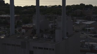 DX0002_162_012 - 5.7K aerial stock footage orbit smoke stacks at a power plant at twilight, Madison, Wisconsin