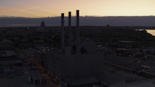 DX0002_162_021 - 5.7K aerial stock footage descend and orbit power plant smoke stacks at twilight, Madison, Wisconsin