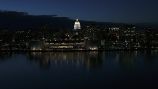 DX0002_162_025 - 5.7K aerial stock footage orbit capitol dome and reveal the convention center at twilight, Madison, Wisconsin