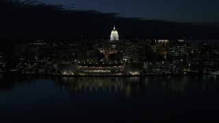 DX0002_162_032 - 5.7K aerial stock footage a stationary view and approach to the capitol dome and convention center at night, Madison, Wisconsin