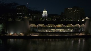 DX0002_162_040 - 5.7K aerial stock footage fly over the convention center and orbit capitol at night, Madison, Wisconsin